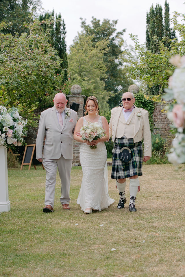 Katie arriving for the outdoor wedding ceremony